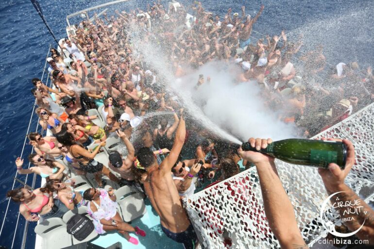 Champagne showers Cirque de la nuit CDLN boat party in playa den bosss ibiza